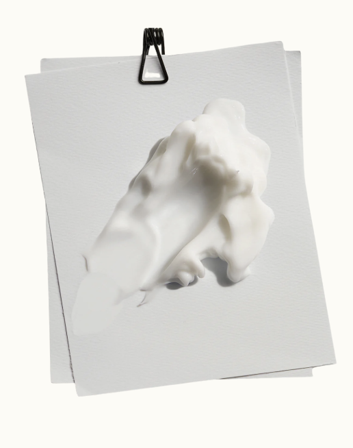 Krämklick på ett papper. Derma Emulsion från Skinome.