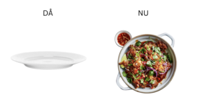 en tom tallrik och en panna med en kycklingrätt.